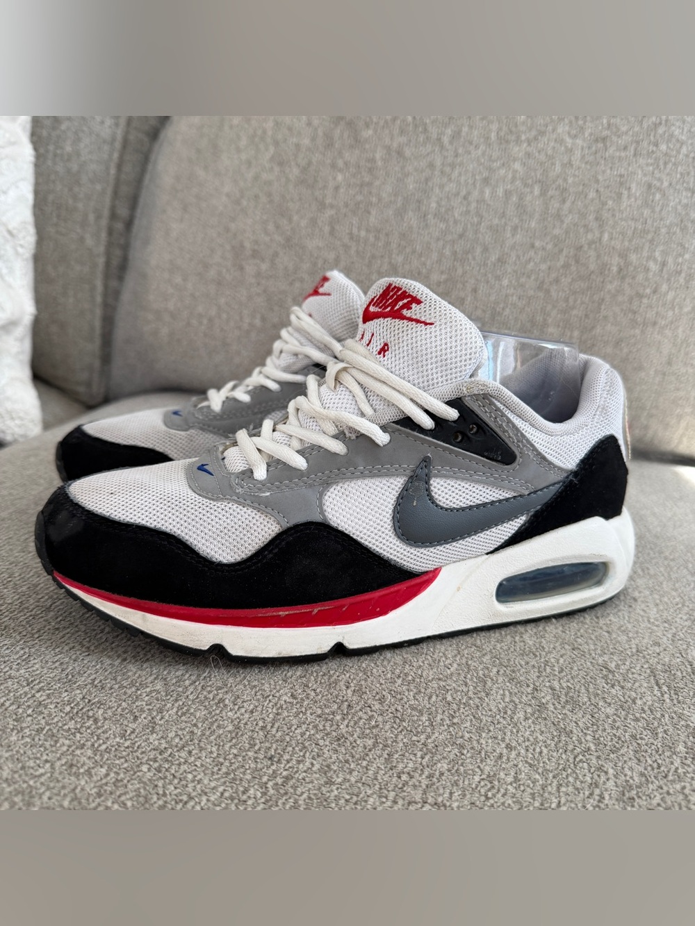 Nike Air Max Correlate sneakers in white, cool grey, and black